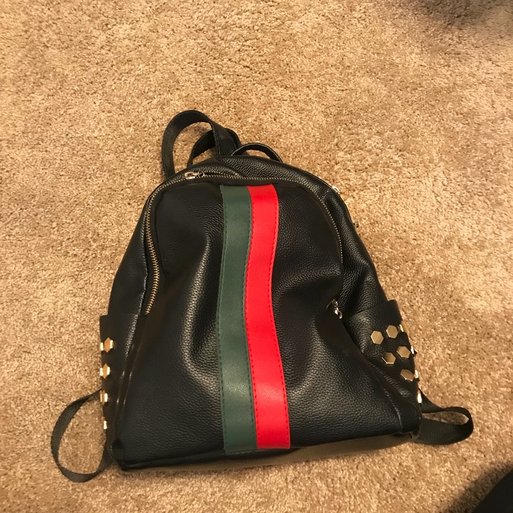 Black little backpack with stripes